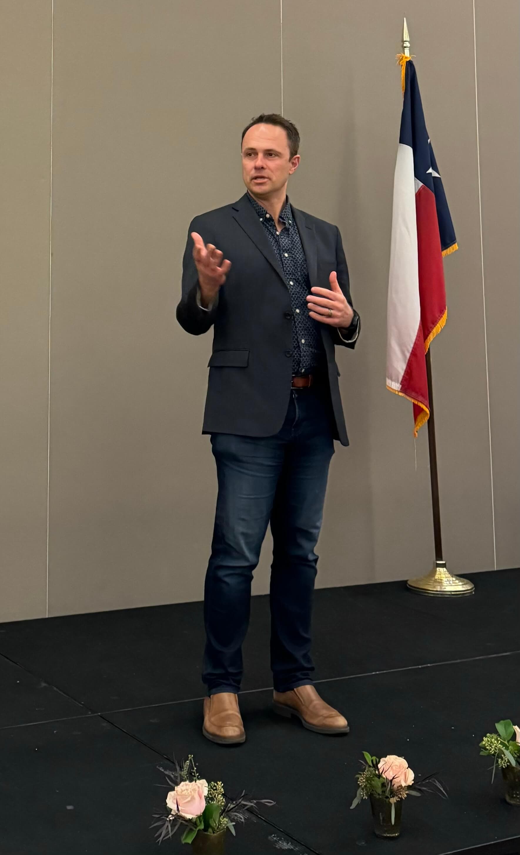 Jason Ochs speaking at a formal leadership event